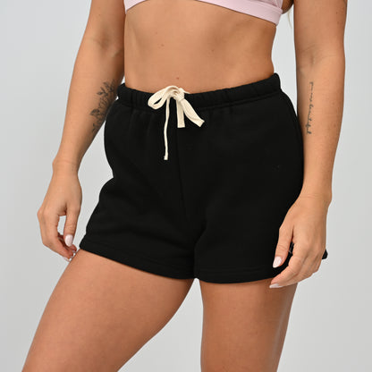 Front mid-shot view of model wearing the black Hybryd Scottsdale matching set sweat shorts   
