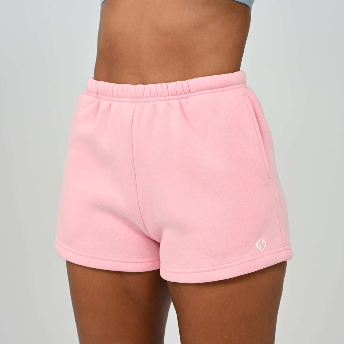 Front view of model wearing pink Hybryd Scottsdale matching set sweat shorts   