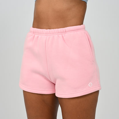Front view of model wearing pink Hybryd Scottsdale matching set sweat shorts   