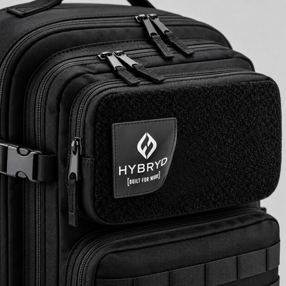 Close-up view of Hybryd logo rubber patch on black 35L tactical fitness bag