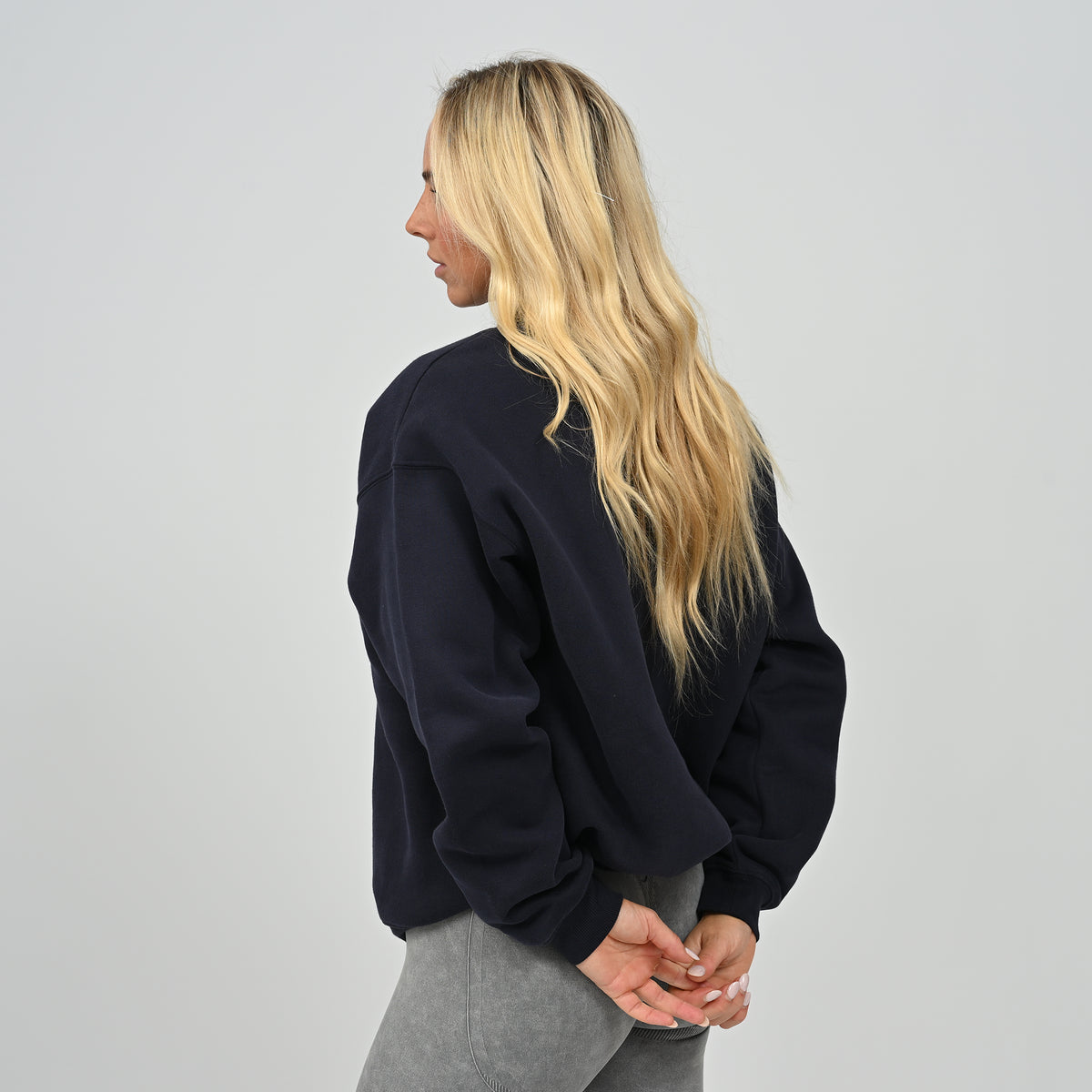 Three-quarter back view showing the relaxed drop shoulder fit on the Women's Jasper navy crew neck sweatshirt