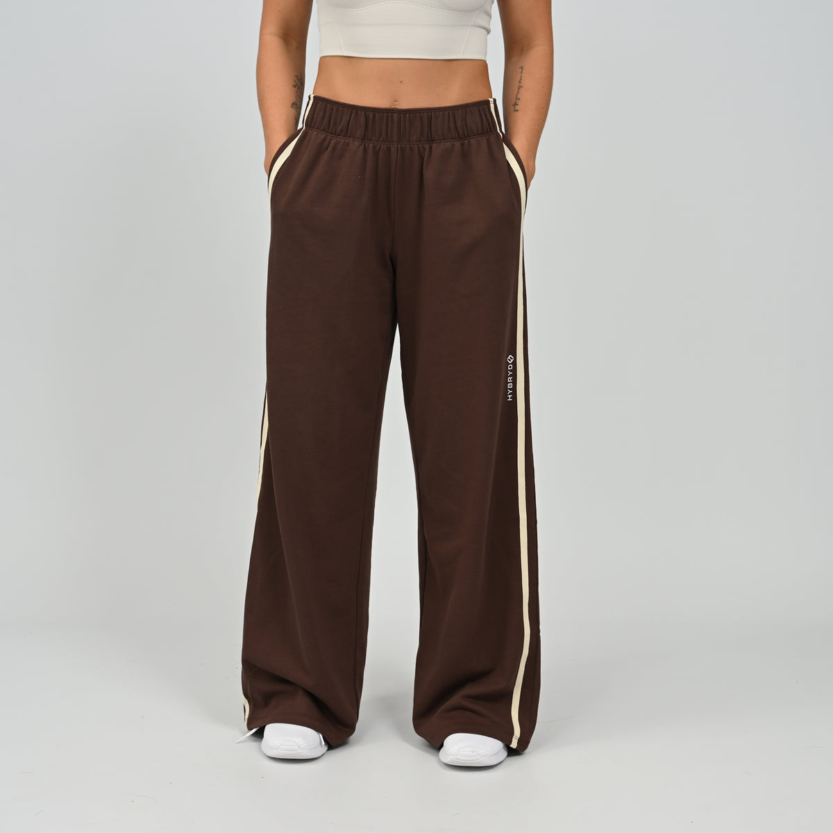Mid-shot view of model in brown Hybryd Milford wide leg joggers   