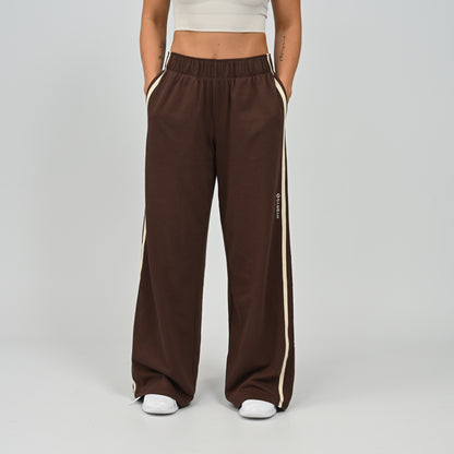 Mid-shot view of model in brown Hybryd Milford wide leg joggers   