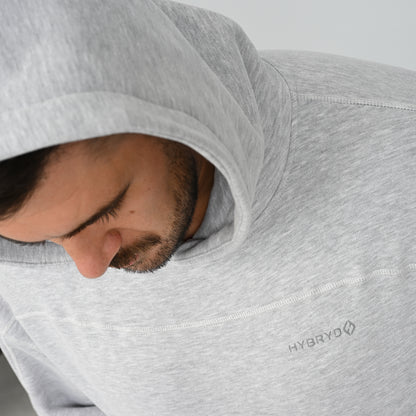 Close-up view of male model wearing the grey Hybryd Palmer fleece lined hoodie with hood up   