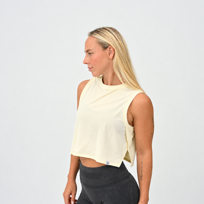 Women’s Ivy Crop Vest in Butter, front view with high neckline and relaxed cropped fit.