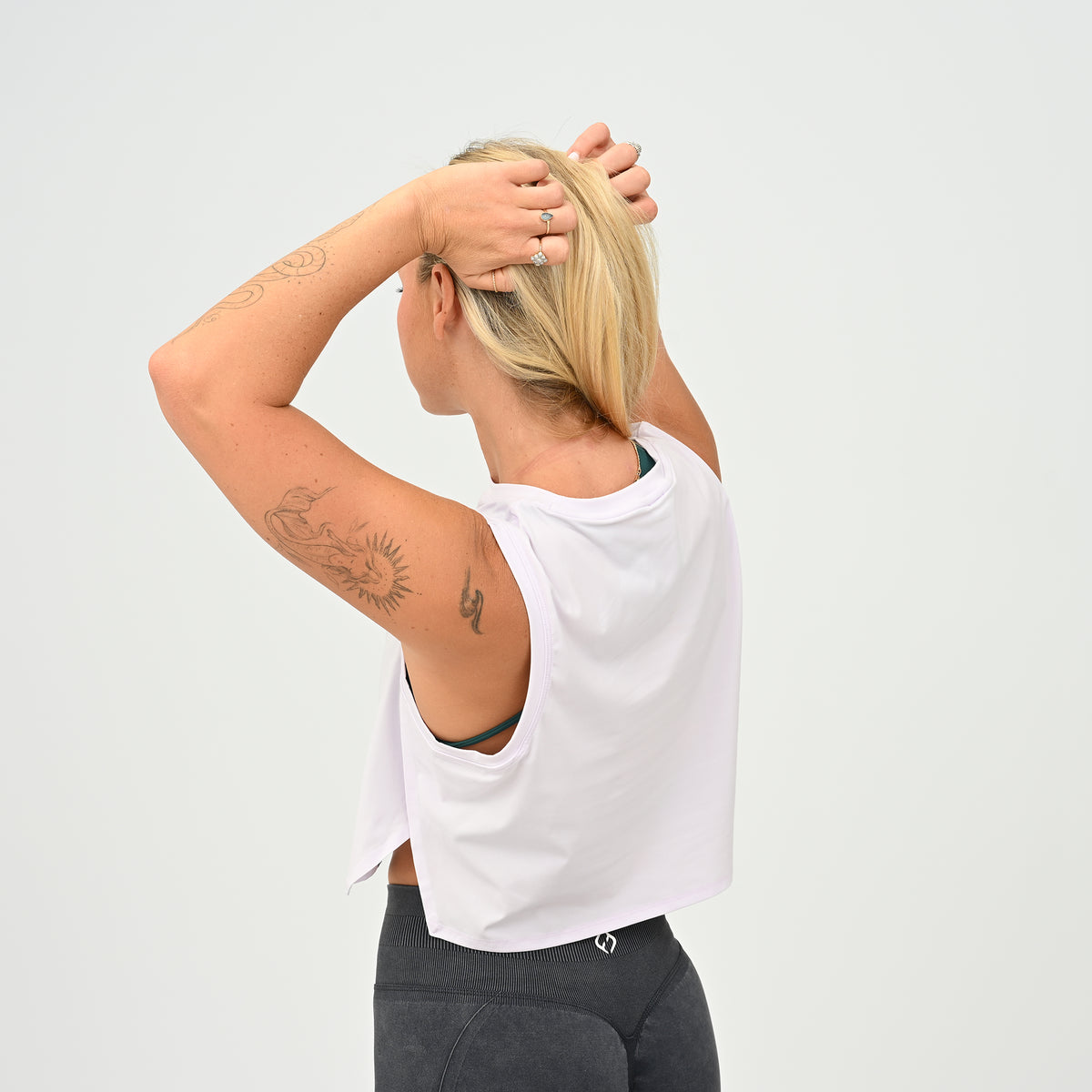 Back view of the women’s lilac Ivy Crop Vest with relaxed fit and wide armholes for training.