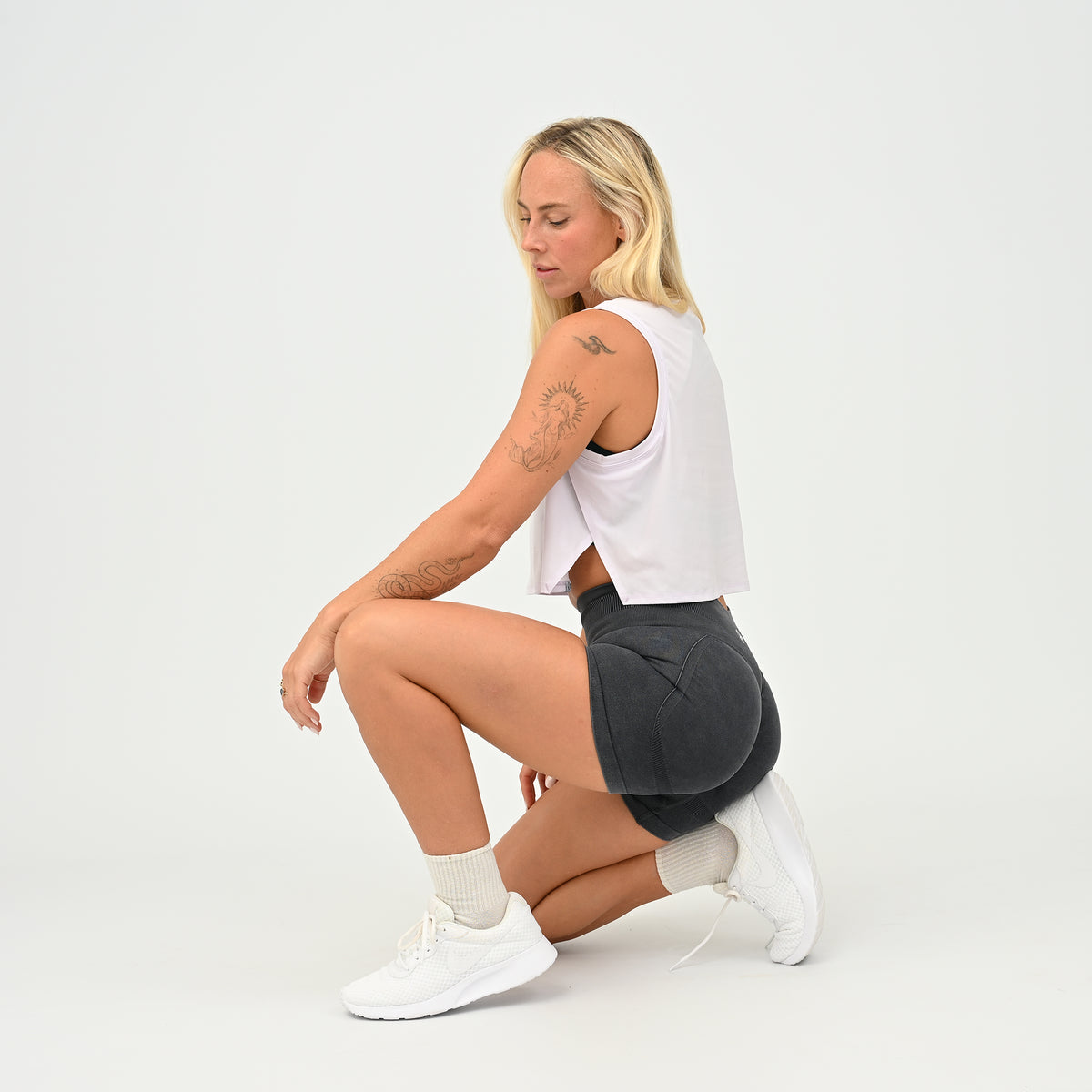Women wearing the lilac Ivy Crop Vest during fitness training, designed for unrestricted movement